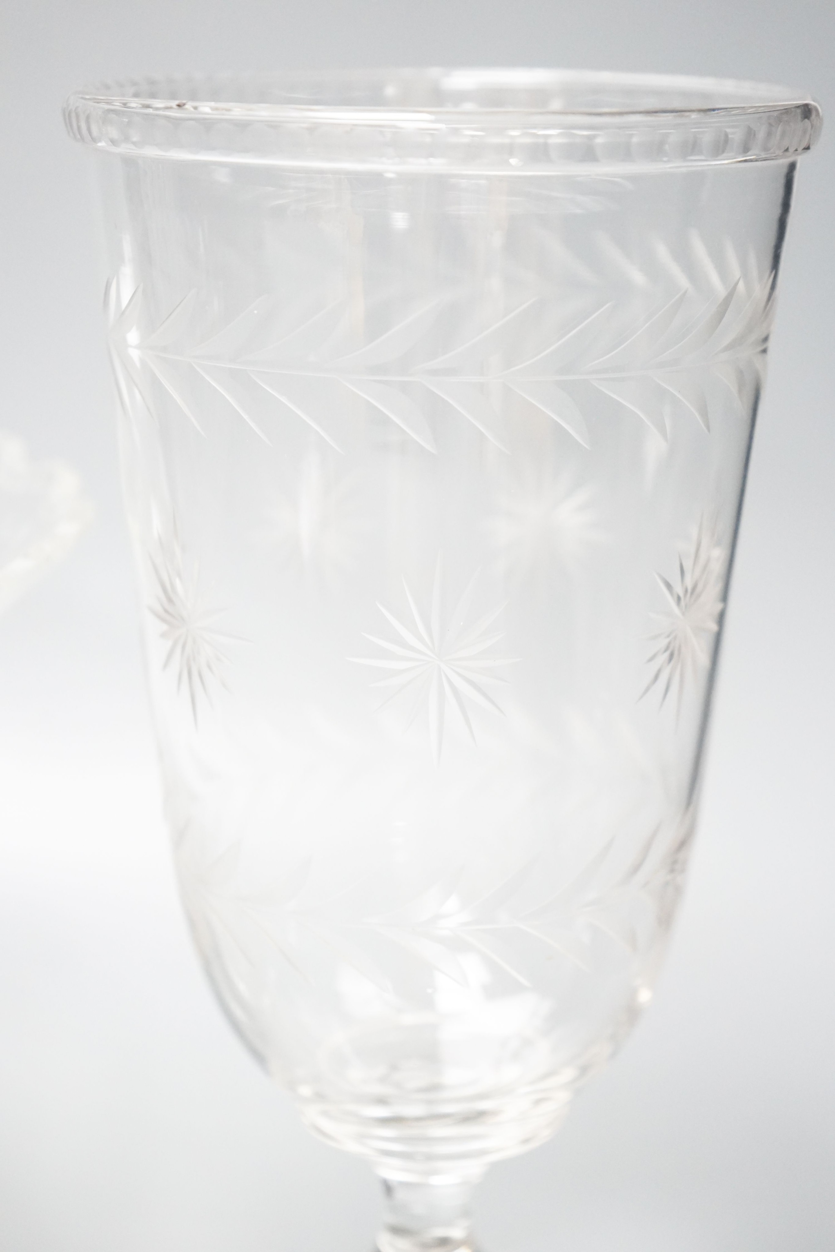 Three early 20th century cut and engraved glass vases 25cm